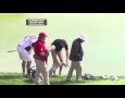 Golfer removes trousers for shot from water
