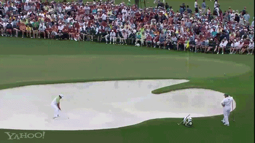 Jason Day holes out from the bunker on the second hole in the final round of the Masters