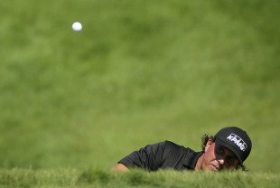Phil Mickelson hits on the 18th hole during the third round of the PGA Championship. (AP)