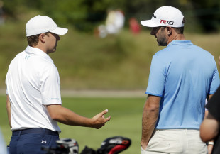 Jordan Spieth (left) talks to Dustin Johnson before a practice round for the PGA Championship. (AP)