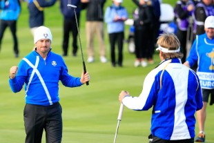AUCHTERARDER, SCOTLAND - SEPTEMBER 26:  Graeme McDowell (L) of Europe celebrates victory with Victor Dubuisson of Europe on the 16th green during the Afternoon Foursomes of the 2014 Ryder Cup on the PGA Centenary course at the Gleneagles Hotel on September 26, 2014 in Auchterarder, Scotland.  (Photo by Harry How/Getty Images)